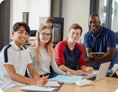 Students and a teacher working together at a table