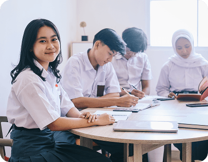 Students studying together at a round table